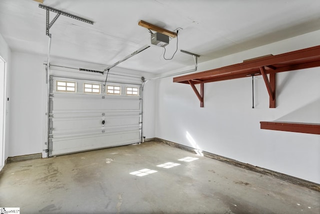 103 Berry Ct, Belton, SC 29627 - garage with a garage door opener and baseboards