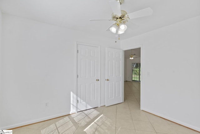 103 Berry Ct, Belton, SC 29627 - unfurnished bedroom featuring light tile patterned floors, baseboards, ceiling fan, and a closet