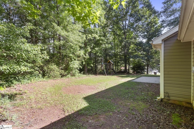 103 Berry Ct, Belton, SC 29627 - view of grassy yard featuring a playground