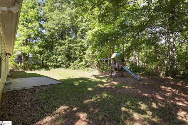 103 Berry Ct, Belton, SC 29627 - view of grassy yard with a playground and a patio area
