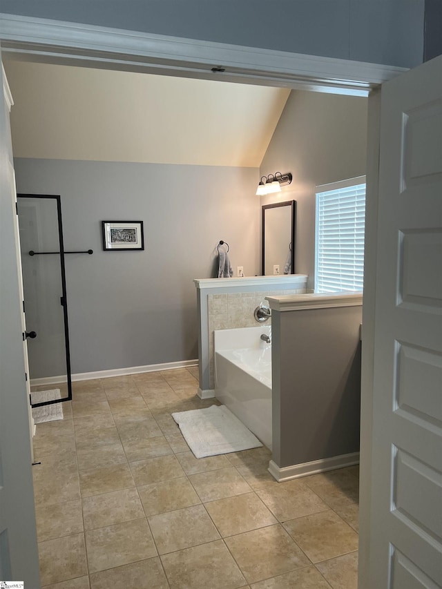 112 Cameron Creek Ln, Simpsonville, SC 29681 - full bathroom featuring vaulted ceiling, a garden tub, tile patterned floors, and baseboards