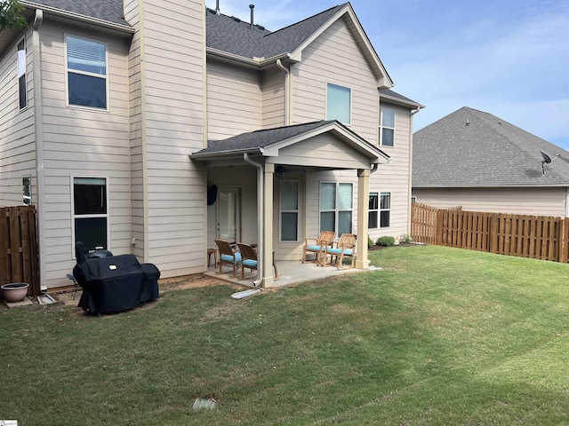 112 Cameron Creek Ln, Simpsonville, SC 29681 - back of property featuring a patio area, a shingled roof, and a chimney