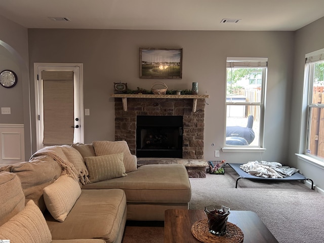 112 Cameron Creek Ln, Simpsonville, SC 29681 - living room with arched walkways, a fireplace, and carpet flooring