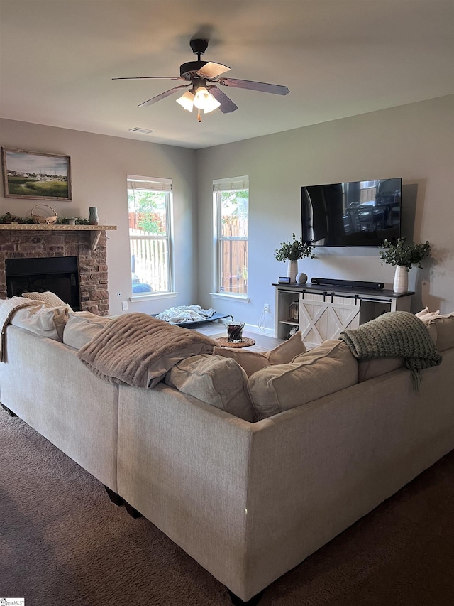 112 Cameron Creek Ln, Simpsonville, SC 29681 - living room with ceiling fan, dark carpet, and a fireplace