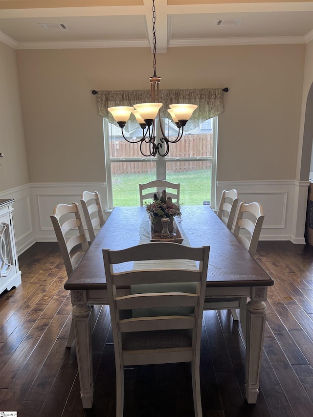112 Cameron Creek Ln, Simpsonville, SC 29681 - dining area with dark wood finished floors, plenty of natural light, ornamental molding, a wainscoted wall, and a chandelier