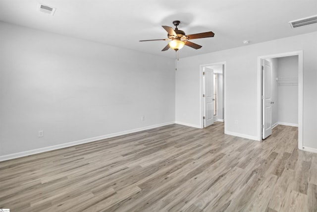 9023 Germaine Ct, Boiling Springs, SC 29316 - unfurnished bedroom featuring light wood finished floors, baseboards, a spacious closet, ceiling fan, and a closet