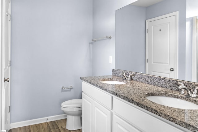 9023 Germaine Ct, Boiling Springs, SC 29316 - full bathroom featuring double vanity, toilet, wood finished floors, and baseboards
