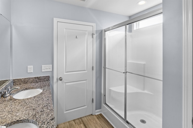 9023 Germaine Ct, Boiling Springs, SC 29316 - bathroom featuring a stall shower, wood finished floors, and double vanity