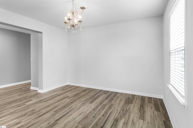 9023 Germaine Ct, Boiling Springs, SC 29316 - empty room with a chandelier, wood finished floors, and baseboards