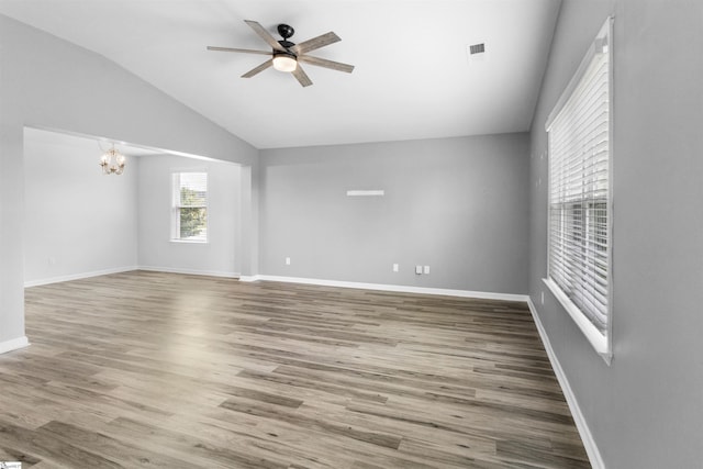 9023 Germaine Ct, Boiling Springs, SC 29316 - unfurnished room with a chandelier, vaulted ceiling, a ceiling fan, wood finished floors, and baseboards