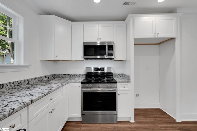 206 Daniels St, Anderson, SC 29625 - kitchen with appliances with stainless steel finishes, dark wood-style floors, white cabinetry, light stone counters, and recessed lighting