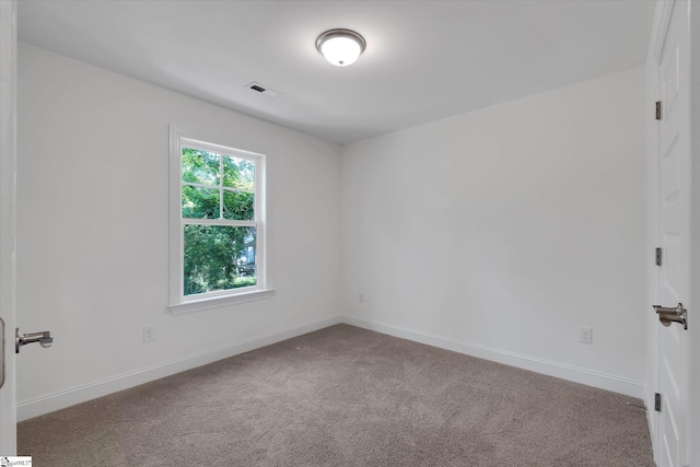 206 Daniels St, Anderson, SC 29625 - carpeted empty room featuring baseboards