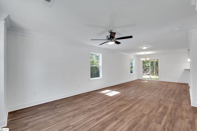 206 Daniels St, Anderson, SC 29625 - spare room featuring crown molding, a ceiling fan, plenty of natural light, wood finished floors, and a chandelier