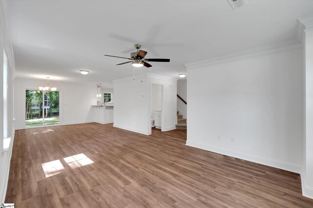 206 Daniels St, Anderson, SC 29625 - unfurnished living room with crown molding, a chandelier, a ceiling fan, stairs, and baseboards