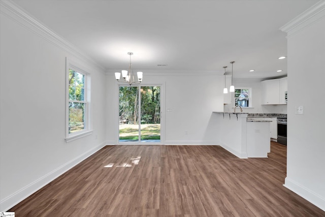206 Daniels St, Anderson, SC 29625 - unfurnished dining area with baseboards, a chandelier, dark wood-style floors, crown molding, and recessed lighting