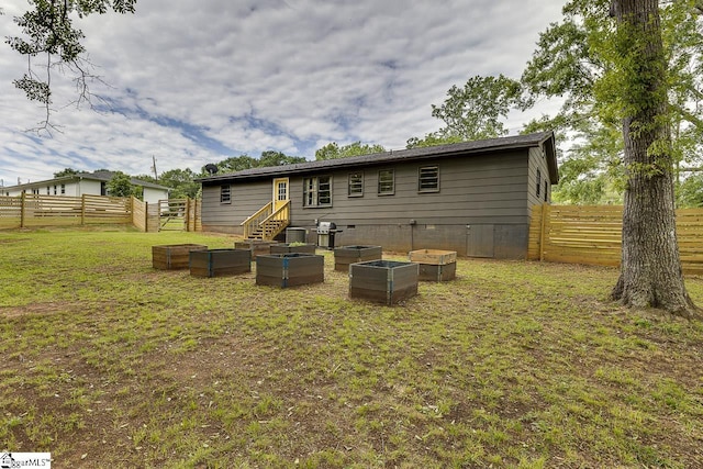 145 Rosewood Cir, Duncan, SC 29334 - back of house featuring a vegetable garden and crawl space