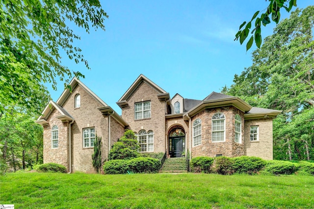 8 Knob Creek Ct, Greer, SC 29651 - traditional-style house featuring a front lawn, brick siding, and stone siding