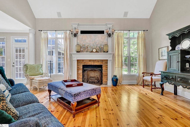 8 Knob Creek Ct, Greer, SC 29651 - living room featuring vaulted ceiling, wood-type flooring, a fireplace, and baseboards