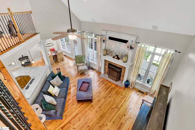 8 Knob Creek Ct, Greer, SC 29651 - living room featuring high vaulted ceiling, a ceiling fan, hardwood / wood-style flooring, healthy amount of natural light, and a fireplace