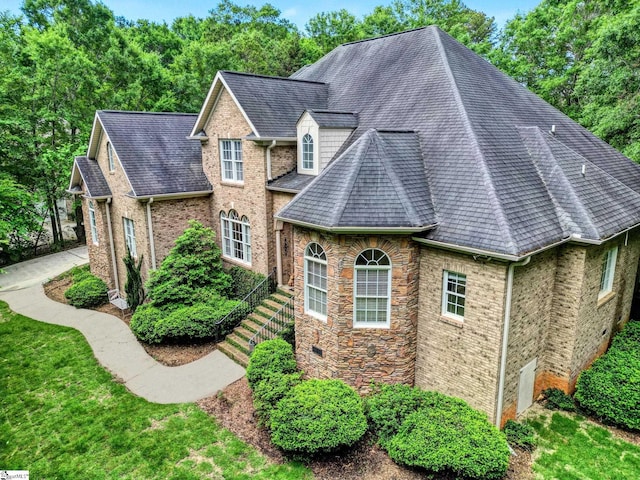8 Knob Creek Ct, Greer, SC 29651 - view of property exterior with a shingled roof and brick siding