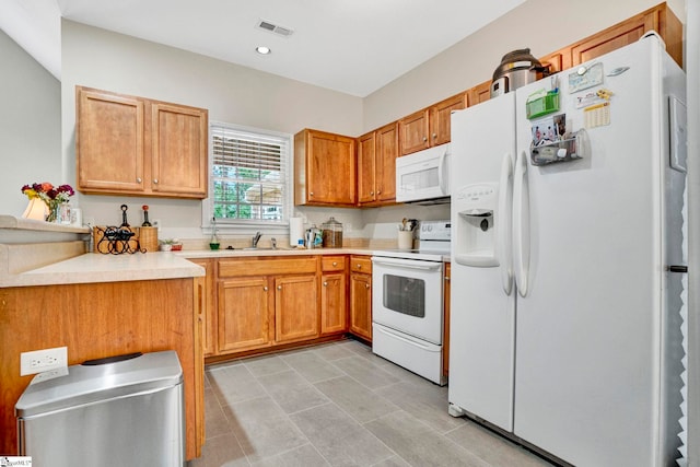 8 Knob Creek Ct, Greer, SC 29651 - kitchen with white appliances, a sink, light countertops, brown cabinets, and recessed lighting