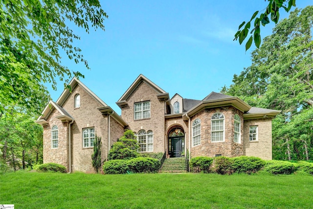 8 Knob Creek Ct, Greer, SC 29651 - traditional home with a front lawn, brick siding, and stone siding