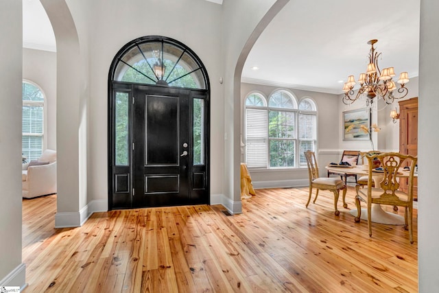 8 Knob Creek Ct, Greer, SC 29651 - entrance foyer featuring arched walkways, ornamental molding, hardwood / wood-style flooring, baseboards, and healthy amount of natural light