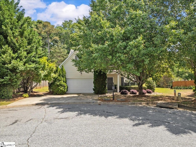 3 Clifford Ct, Simpsonville, SC 29681 - view of property hidden behind natural elements with concrete driveway and a garage