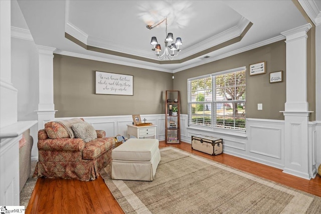 3 Clifford Ct, Simpsonville, SC 29681 - sitting room featuring decorative columns, wood finished floors, crown molding, a raised ceiling, and wainscoting