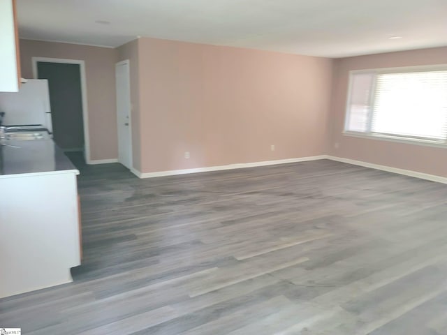 200 Lincoln Dr, Gaffney, SC 29341 - unfurnished living room featuring dark wood-style floors and baseboards