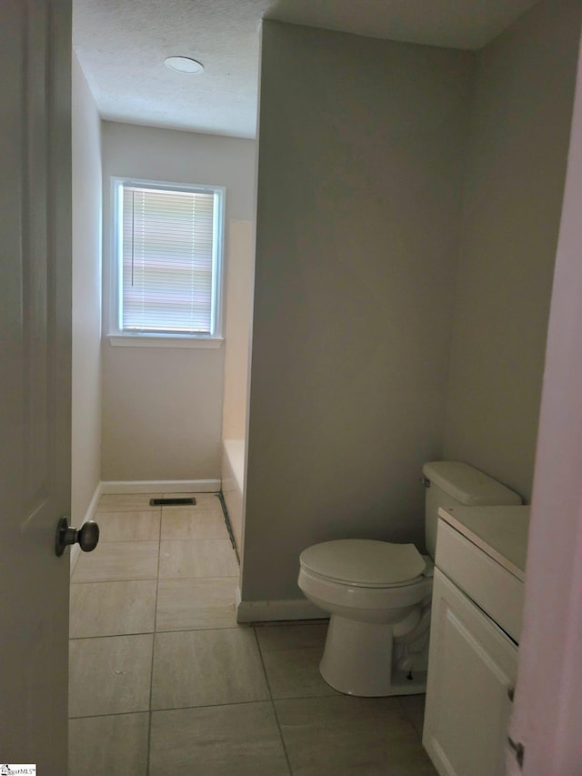 200 Lincoln Dr, Gaffney, SC 29341 - bathroom with toilet, vanity, a tub, baseboards, and tile patterned flooring