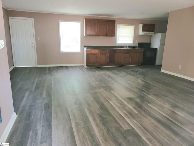 200 Lincoln Dr, Gaffney, SC 29341 - kitchen with freestanding refrigerator, dark wood finished floors, dark countertops, and ornamental molding