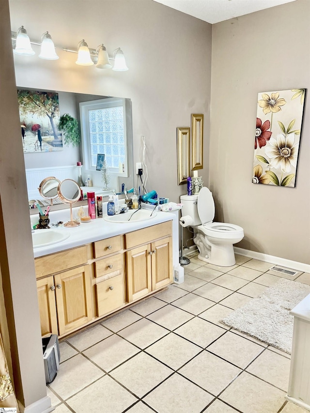 191 Amberwood Dr, Anderson, SC 29621 - bathroom featuring tile patterned flooring, double vanity, and toilet
