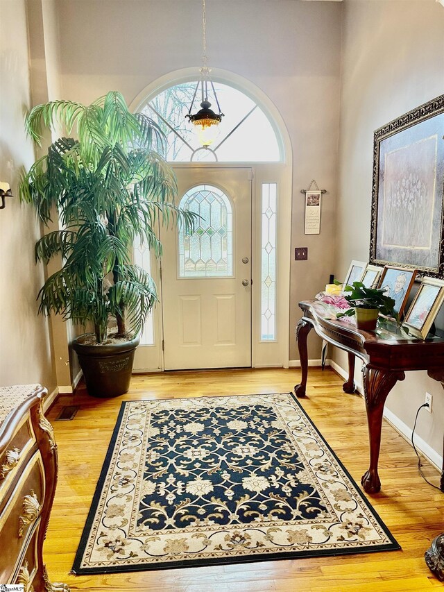 191 Amberwood Dr, Anderson, SC 29621 - foyer with light wood-type flooring, a high ceiling, and baseboards