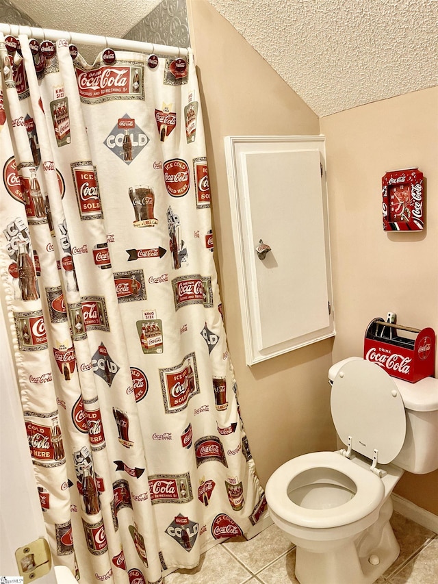 191 Amberwood Dr, Anderson, SC 29621 - full bath with a textured ceiling, tile patterned floors, toilet, baseboards, and curtained shower
