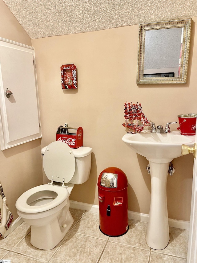 191 Amberwood Dr, Anderson, SC 29621 - bathroom featuring a textured ceiling, tile patterned floors, toilet, baseboards, and a sink