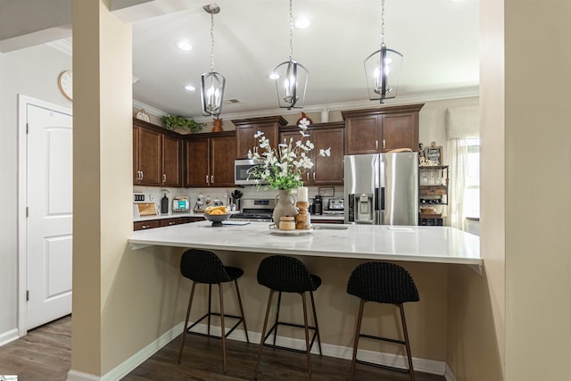 111 Crisp Cameo Ct, Greer, SC 29651 - kitchen featuring stainless steel appliances, ornamental molding, light countertops, decorative backsplash, and dark brown cabinetry