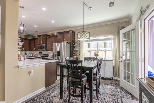 111 Crisp Cameo Ct, Greer, SC 29651 - dining area featuring ornamental molding, recessed lighting, and wood finished floors