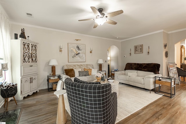 111 Crisp Cameo Ct, Greer, SC 29651 - living area featuring arched walkways, wood finished floors, a ceiling fan, and ornamental molding