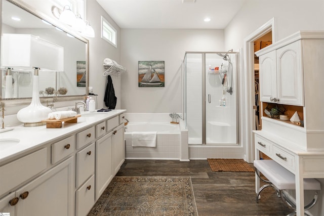 111 Crisp Cameo Ct, Greer, SC 29651 - full bathroom with wood finished floors, a stall shower, a garden tub, double vanity, and recessed lighting