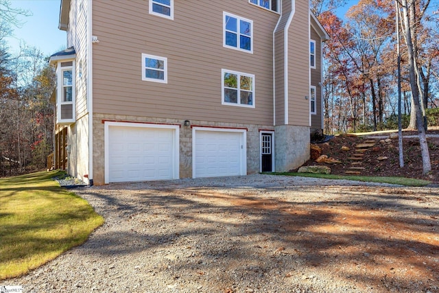 183 Wittmore Ln, Cleveland, SC 29635 - view of property exterior featuring a garage, dirt driveway, and a chimney