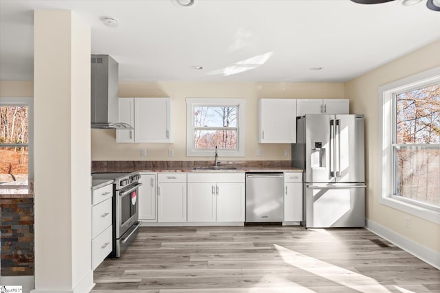 183 Wittmore Ln, Cleveland, SC 29635 - kitchen featuring stainless steel appliances, a sink, wall chimney range hood, light wood-style floors, and recessed lighting