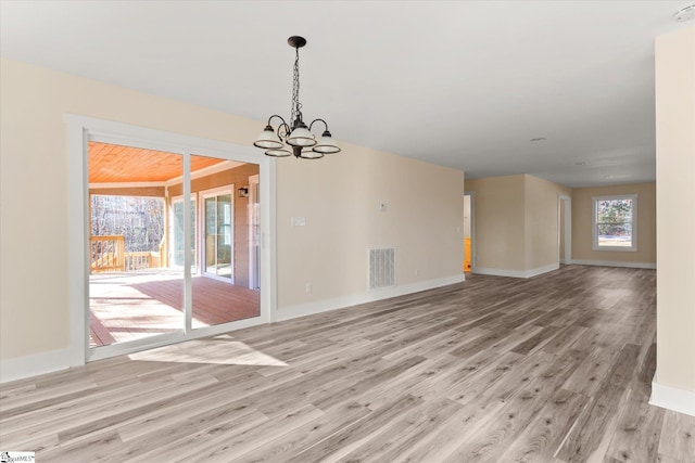 183 Wittmore Ln, Cleveland, SC 29635 - unfurnished room with light wood-type flooring, a chandelier, baseboards, and a smoke detector