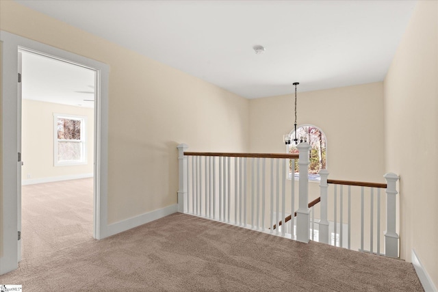 183 Wittmore Ln, Cleveland, SC 29635 - hall with carpet, an upstairs landing, a chandelier, and baseboards