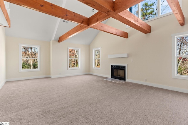 183 Wittmore Ln, Cleveland, SC 29635 - unfurnished living room featuring baseboards, beamed ceiling, light carpet, and high vaulted ceiling