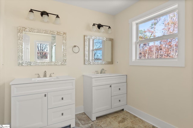 183 Wittmore Ln, Cleveland, SC 29635 - bathroom featuring baseboards, healthy amount of natural light, and two vanities