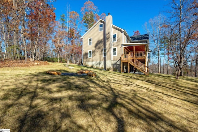 183 Wittmore Ln, Cleveland, SC 29635 - rear view of house featuring stairs, a chimney, and a lawn