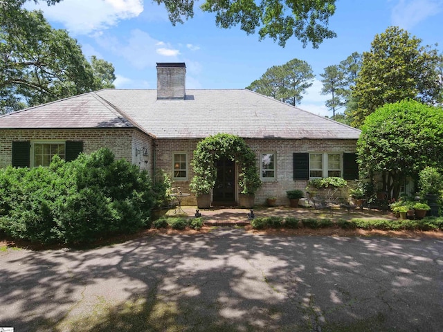 117 Montgomery Dr, Spartanburg, SC 29302 - view of front of house with brick siding and a chimney