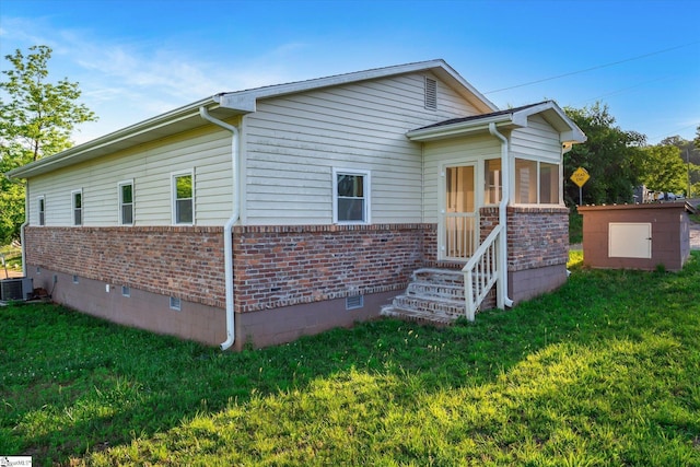402 Laurel And Hardy Lake Rd, Marietta, SC 29661 - view of front of home featuring brick siding, crawl space, a front yard, central AC unit, and entry steps