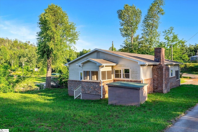 402 Laurel And Hardy Lake Rd, Marietta, SC 29661 - bungalow-style home featuring a chimney, a front lawn, and brick siding